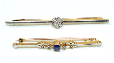 Lot 98 - A sapphire and diamond bar brooch, an oval cut sapphire spaced by old cut diamonds in milgrain...