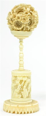 Lot 99 - A 19th century Chinese carved ivory puzzle ball on stand