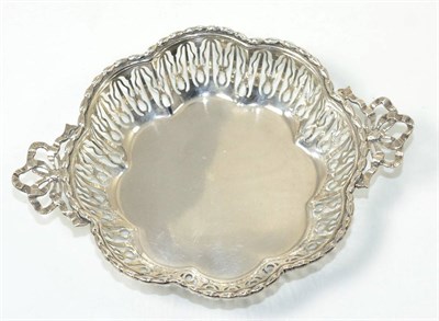 Lot 101 - A silver bon bon dish retailed by Asprey, London with pierced sides and ribbon tied handles