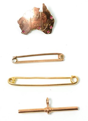 Lot 102 - A ruby set Australian states brooch, measures 2.5cm by 2.5cm, stamped '9CT'; a tie bar, stamped...