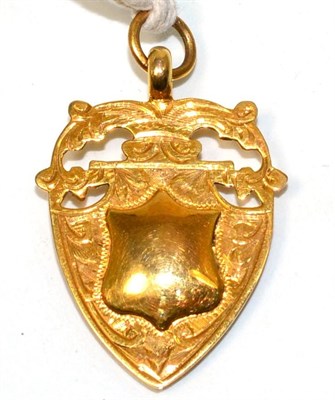 Lot 106 - A 9ct gold shield fob with presentation inscription dated 1930