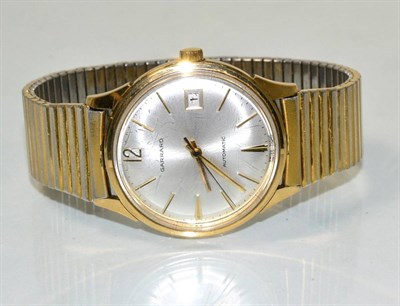 Lot 112 - A Garrard 9 carat gold gents wristwatch, with presentation inscription and original box