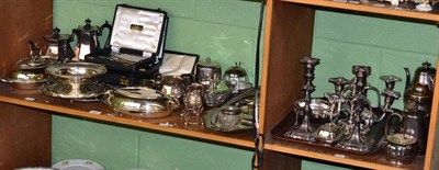 Lot 145 - A collection of silver plate including flatware and hollow ware, etc (two shelves)