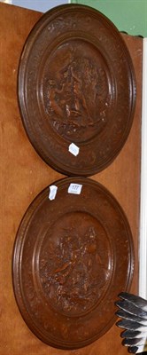 Lot 177 - A pair of relief decorated plaques by Elkiington