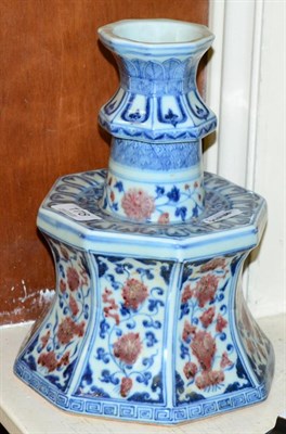 Lot 178 - A Chinese porcelain candlestick underglazed in blue and red