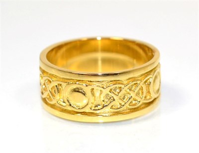 Lot 220 - An 18 carat gold Celtic motif band ring, finger size M