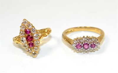 Lot 223 - An 18 carat gold ruby and diamond navette ring, three round cut rubies within a border of old...