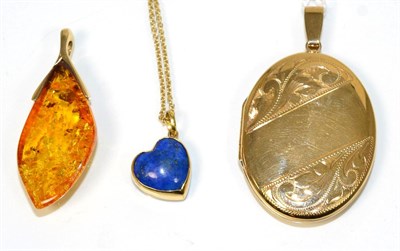 Lot 226 - A lapis lazuli pendant on chain, a heart cabochon lapis lazuli with an off-centre bail,...