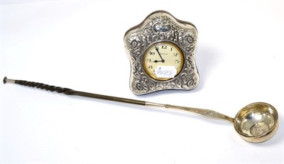 Lot 233 - A silver toddy ladle inset with Charles II coins and a Victorian silver travelling clock timepiece