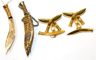 Lot 237 - A Gurkha Kukri tie bar and cufflink suite and a kukri brooch (4)