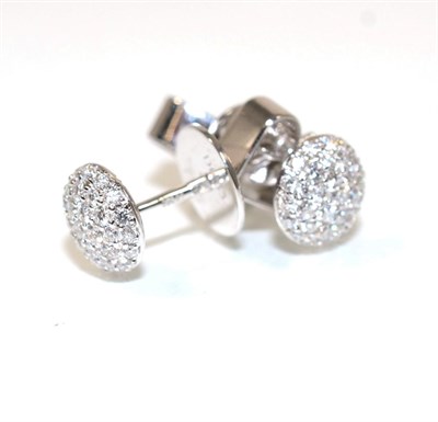 Lot 241 - A pair of 18 carat white gold diamond cluster earrings, a circular dome pavé set with round...