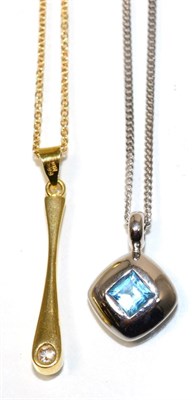 Lot 242 - An 18 carat gold solitaire diamond pendant, on chain, a round brilliant cut diamond in a rubbed...