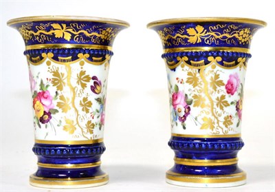 Lot 252 - A pair of floral painted porcelain spill vases