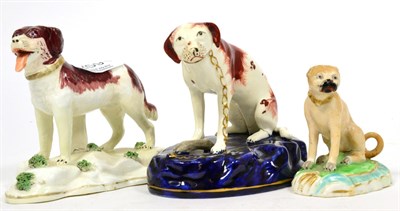 Lot 259 - A 19th century Derby porcelain model of a seated pug, a Staffordshire model of a seated hound...