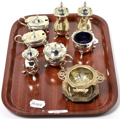 Lot 263 - A silver tea strainer, London 1913 and seven various condiments