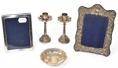 Lot 282 - Two silver photograph frames; a Continental silver dish set with a coin; and a pair of...