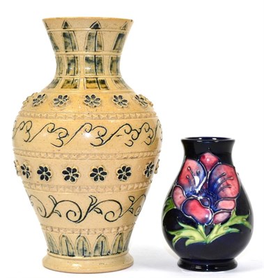 Lot 285 - A Moorcroft small Anemone pattern vase and a Doulton Lambeth stoneware vase (2)