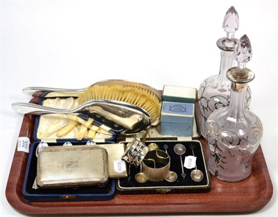 Lot 302 - A group of silver items to include a cigarette case; napkin rings; cased teaspoons; overlaid...