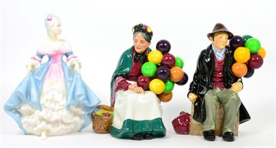 Lot 308 - A Royal Doulton 'Old Balloon Seller' H.N.1315; 'Balloon Man' H.N.1954 and 'Southern Belle' H.N.2425