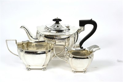 Lot 311 - A silver three piece tea set