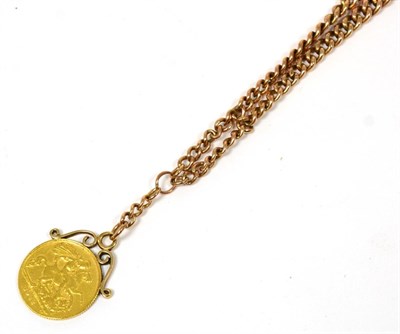 Lot 343 - A 9 carat gold curb linked watch chain with attached half sovereign dated 1912