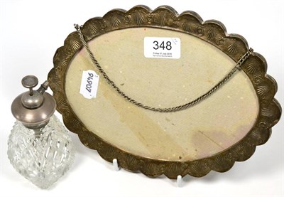 Lot 348 - An embossed white metal mirror frame (glass broken) and a sterling and glass atomiser (2)