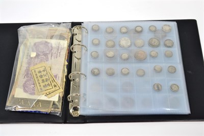 Lot 349 - An album containing 83 coins comprising 51 x foreign coins, of which 16 x silver including...