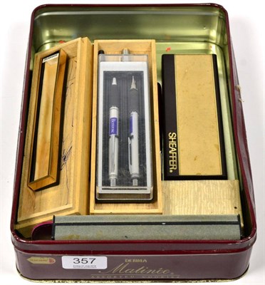 Lot 357 - A group of pens inlcuding a Sheaffer fountain pen, a Sheaffer gold plated slim profile Targa...