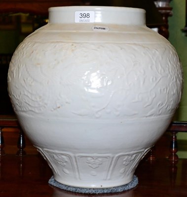 Lot 398 - A large Chinese porcelain white glazed vase with carved decoration