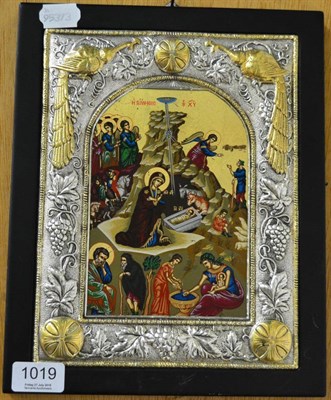 Lot 1019 - A religious icon within a continental silver and silver gilt frame, decorated with vines and...