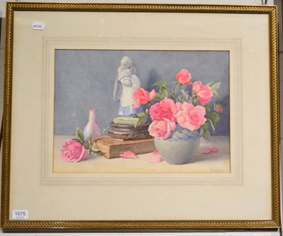 Lot 1075 - F Suddards, still life of pink roses beside a statue and a book, watercolour