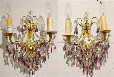 Lot 1125 - An amethyst glass and clear glass chandelier and a pair of matching wall sconces