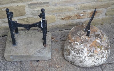 Lot 1167 - Two 19th century iron boot scrapers, each on a stone base