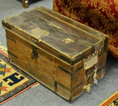 Lot 1168 - A late 19th century leather sea chest, with labels, red lined interior