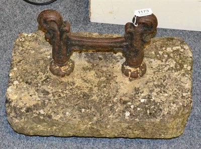 Lot 1173 - A 19th century iron boot scraper on sandstone base