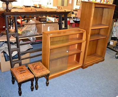 Lot 1184 - A priory corner reproduction open bookcase, a glazed oak bookcase, a pair of New Zealand stools...