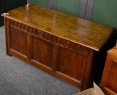 Lot 1189 - An early 20th century oak blanket box