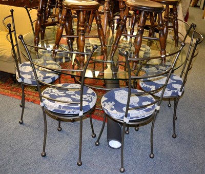 Lot 1191 - A contemporary designer nine piece steel dining suite, comprising 5ft diameter circular glass...