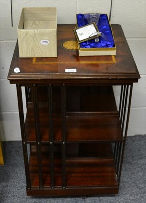 Lot 1199 - A reproduction mahogany inlaid revolving bookcase, with a bevelled mirror and two others (4)