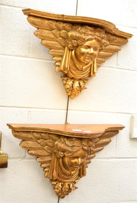 Lot 1208 - Two large cherub gilt wall brackets