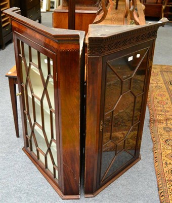 Lot 1212 - An inlaid mahogany astragal glazed corner cupboard and another similar example (2)