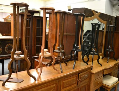 Lot 1213 - A mahogany and crossbanded square occasional table, a set of six of tripartate plant stands...