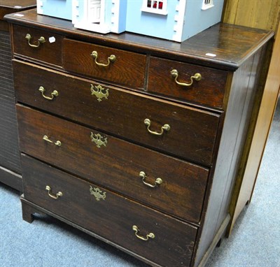 Lot 1223 - A George III oak four height chest of drawers