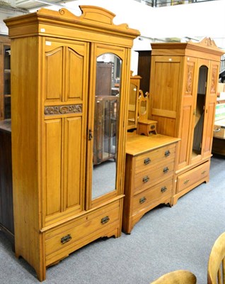 Lot 1225 - A pine mirror fronted wardrobe and matching dressing table together with a further wardrobe (3)