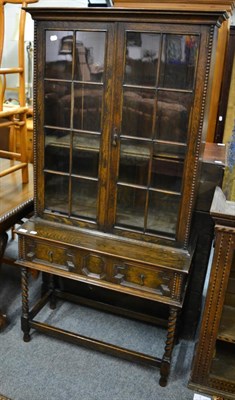 Lot 1242 - Oak bookcase on stand