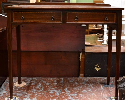 Lot 1248 - An Edwardian crossbanded mahogany side table fitted with two frieze drawers