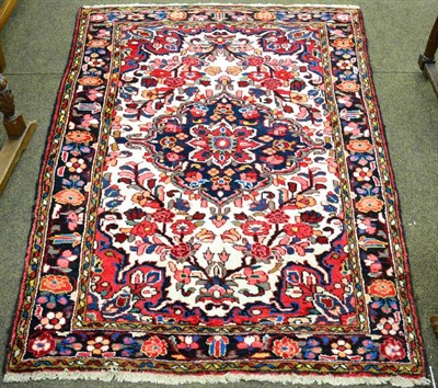 Lot 1262 - Bordjalou rug West Iran, the ivory field with an indigo medallion, enclosed by spandrels and floral