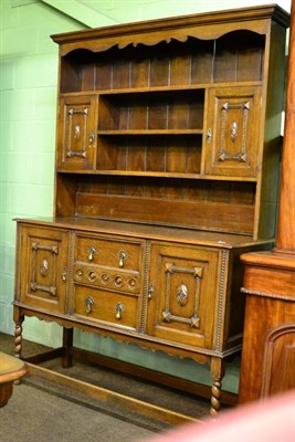 Lot 1282 - An early 20th century oak dresser and rack