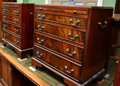 Lot 1294 - A pair of reproduction mahogany four height bedside chests of drawers, each fitted with a...