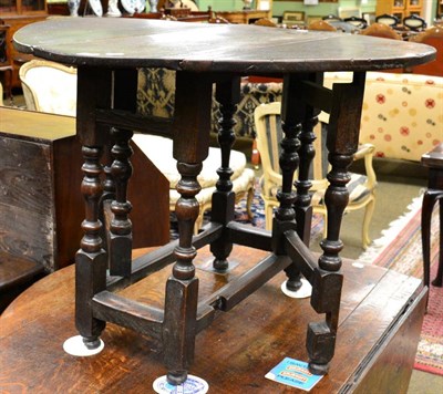 Lot 1305 - An 18th century oak gateleg table